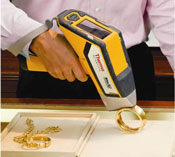 Man analyzing gold bangle bracelet using Niton XL2 precious metal analyzer